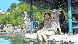 足湯に浸かっている若い女性