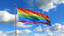 青い空に翻るLGBTを意識した虹色の旗
