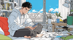 自宅の部屋でスマホをいじくっている若い男性