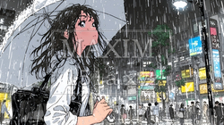 雨の中を傘をさして歩く若い女性