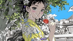和服姿でリンゴ飴を持つ若い女性