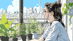 観葉植物の世話をする若い女性