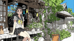 風鈴の音色を聞いている若い女性