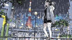 雨の中を傘をささずに歩く若い女性