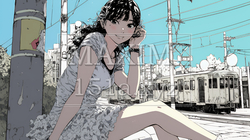 ホームで電車待ちをしている若い女性