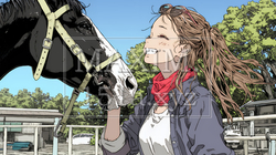 馬の世話をしている若い女性