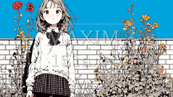 晴天の日にレンガブロックのある花壇の前に立つ少女