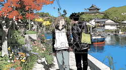 旅先で紅葉観光をしている若いカップル