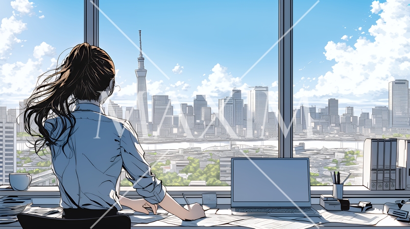 職場のデスクでパソコンに向かって仕事をしているビジネスウーマン