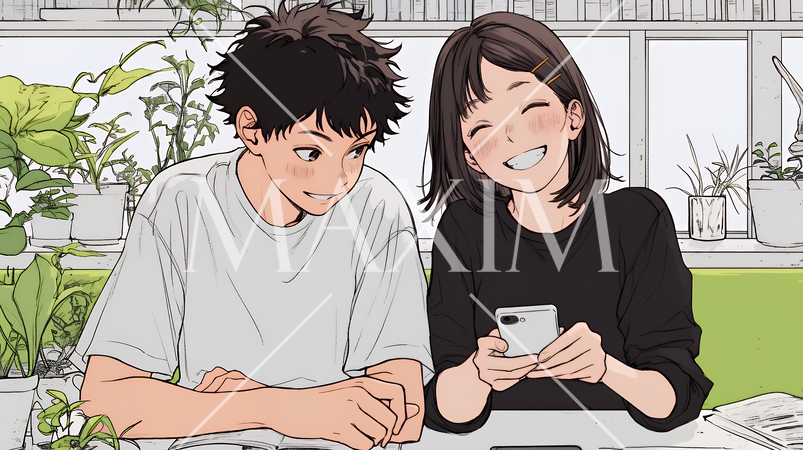 幸せそうに一緒にスマホを見る若いカップル