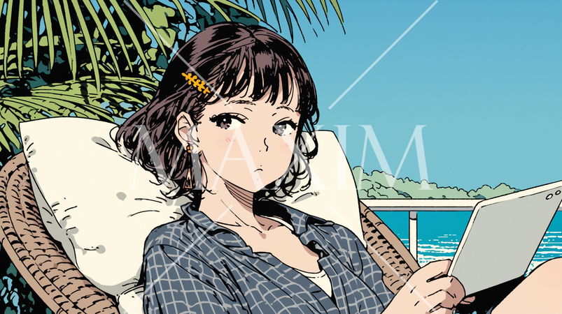 沖縄の海辺でスマートフォン・タブレットを操作している若い女性