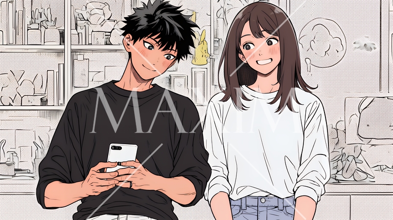 幸せそうに一緒にスマホを見る若いカップル