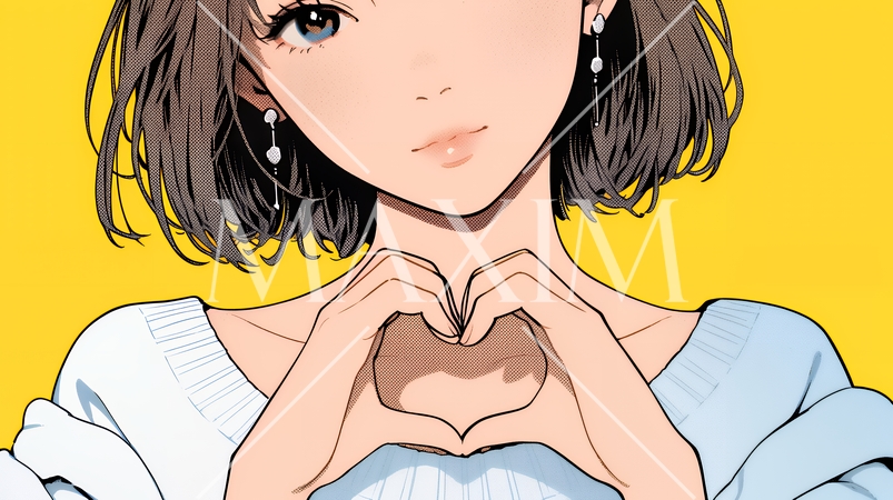 ハートマークを手で作り愛情表現をしている若い女性