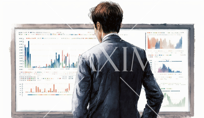 モニターに表示された株価チャートと注文画面を見つめる男性トレーダーの後ろ姿。