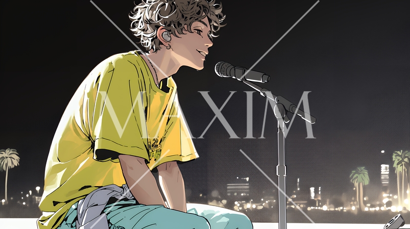 ステージでマイクを握り、情熱的に歌い上げる男性