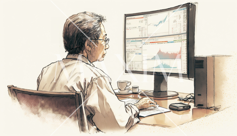 デスクに向かって取引画面を操作する男性トレーダーの横顔。