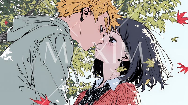 秋の紅葉の下でキスをしている若い恋人たち