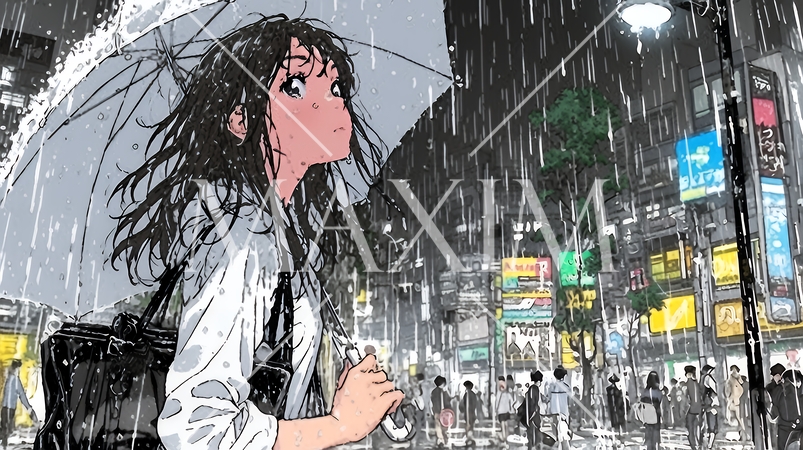 雨の中を傘をさして歩く若い女性