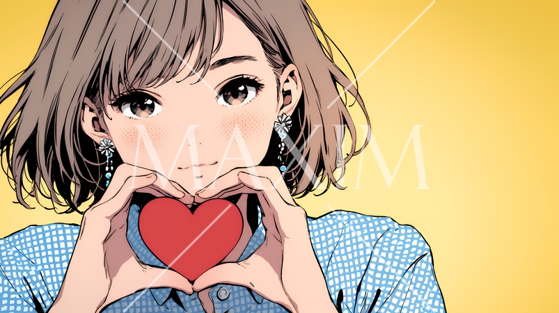 ハートマークを手で作り愛情表現をしている若い女性