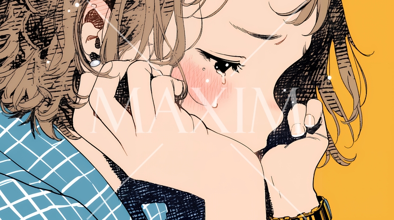 唇を噛んで不安そうな表情をしている若い女性