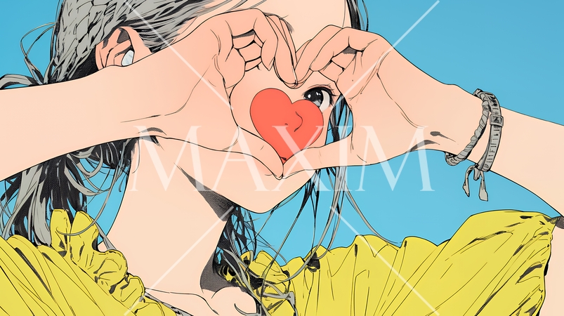 ハートマークを手で作り愛情表現をしている若い女性