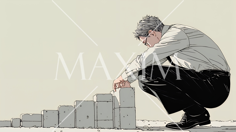 コンクリートブロックを積み上げているビジネスマン：計画の段階的積み重ねの比喩