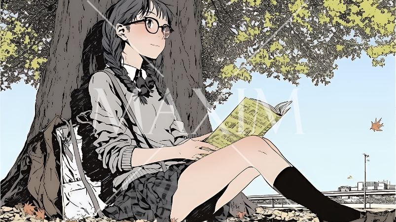 読書の秋：紅葉の木の下で本を読んでいる若い女性