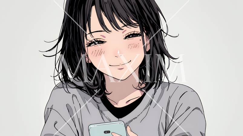 楽しそうにスマホ画面を眺めている若い女性