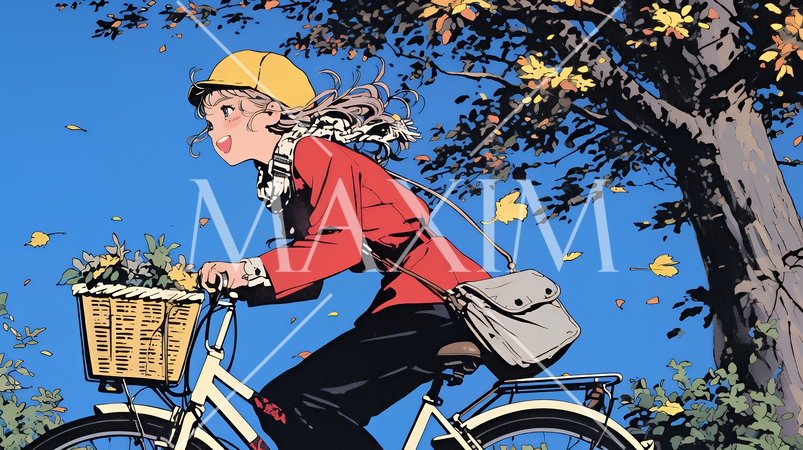 秋の景色：紅葉の小径を自転車を漕ぐ若い女性
