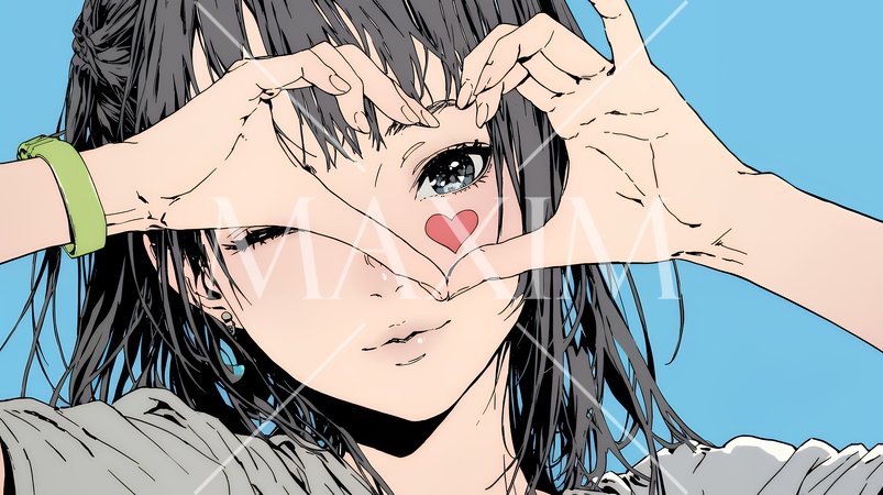 ハートマークを手で作り愛情表現をしている若い女性