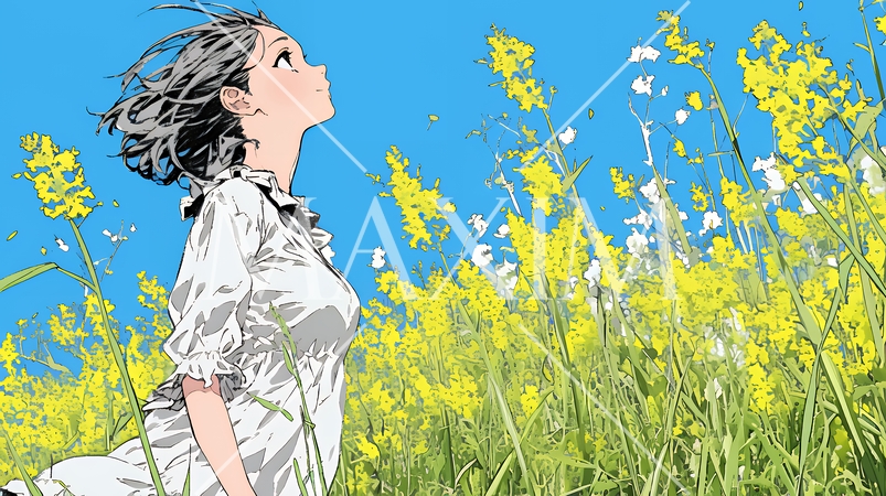 菜の花畑にいる若い女性