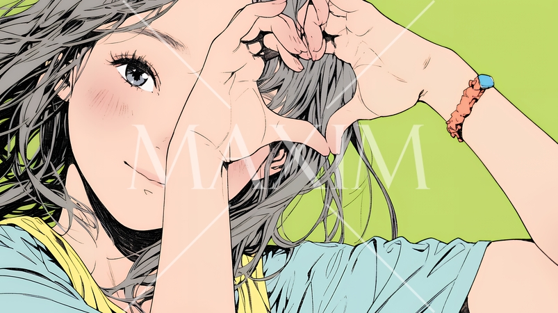 ハートマークを手で作り愛情表現をしている若い女性