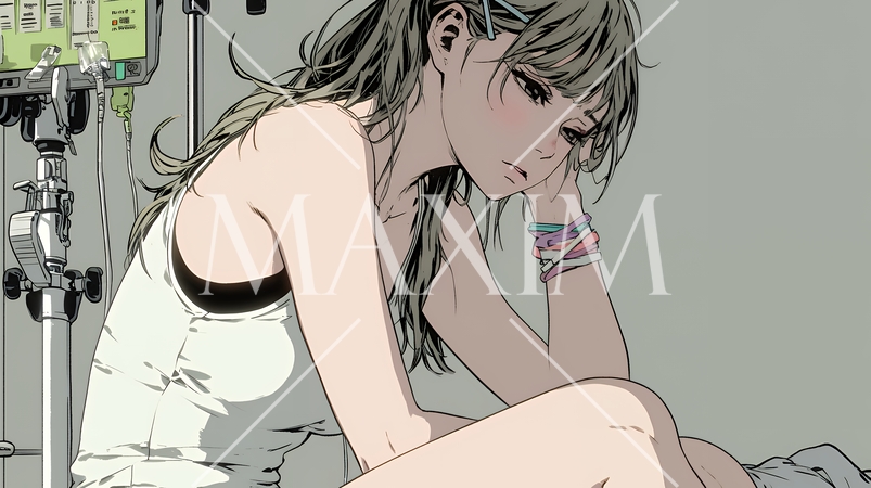 病院のベッドに腰掛けて気落ちしている女性